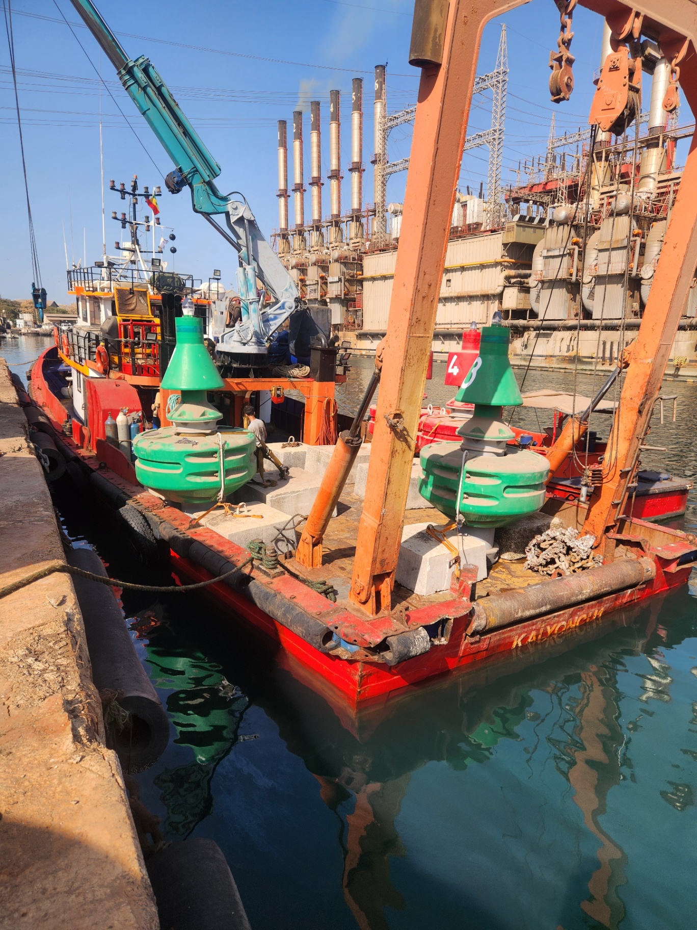 Support vessel with navigational buoys ready for deployment