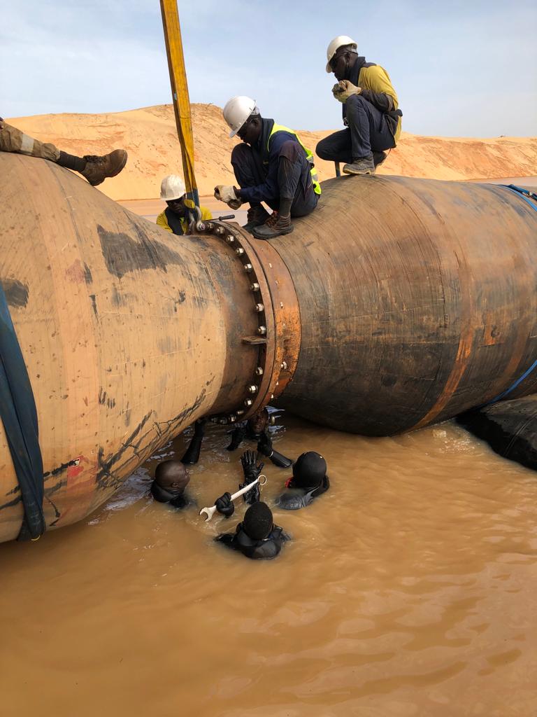 Divers working on a subsea pipeline flange